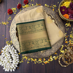 Vriksham Soft Cream With Gold Butta & Veldhaari Green Zari Border Kanchi Silk Saree-VS4770