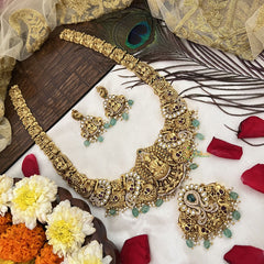 Vriksham Gold Plated Lakshmi Pendant With Peacock AD Stone Long Neckpiece-Aqua Green Bead-G19146