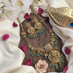 Vriksham Gold Look Alike AD Stone Lakshmi Pendant Long Neckpiece-Green Bead-G16161