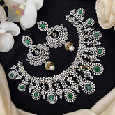 Vriksham Rhodium Plated CZ With Green Pear Cut Drops For Party Wear Short Neckpiece-G21548