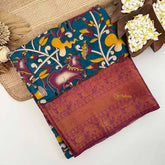 Vriksham Teal Blue Cow & Floral Printed With Black Kanchi Border Kalamkari Saree-VS5012