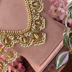 Vriksham Classic Diya With Lakshmi Pendant Pearls Detailing Guttapusalu Bridal Set-G21091