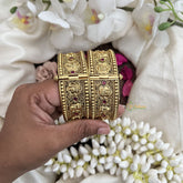 Vriksham Lakshmi Gold With Engraved Floral Patterns & Ruby Stone-Screw Type Bangles-G19921