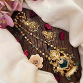 Vriksham Exquisite Matte Gold Lord Ganesha With Handcrafted Floral Jhumkas & Emerald Accents-G21834