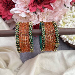 Vriksham Starry Bloom Orange Glass Bangles with Floral Emerald Kundan Work-G19838