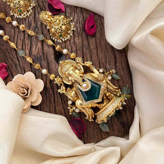 Vriksham Exquisite Matte Gold Lord Ganesha With Handcrafted Floral Jhumkas & Emerald Accents-G21834